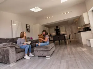 Parents sat in kitchen, having a conversation